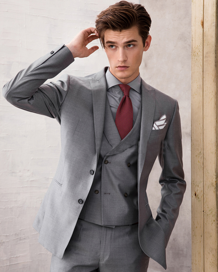 A double-breasted business suit in complete gray for early spring.